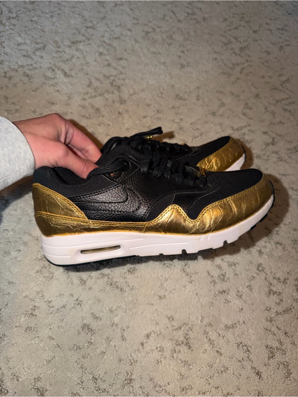 Nike Air Max Black and Metallic Gold sneakers